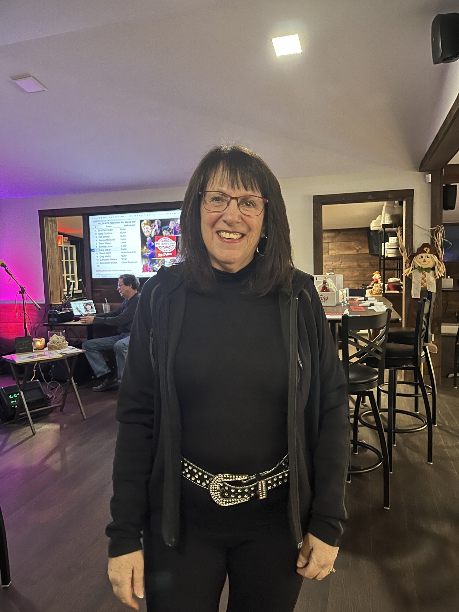 Beverly smiling at the venue before a show